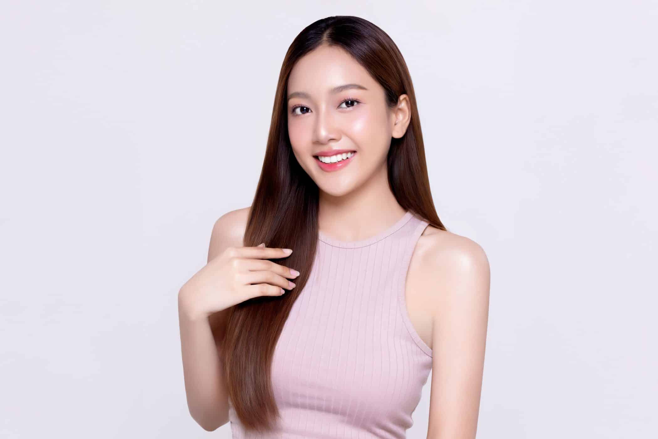 A woman displays her long, straight type of hair