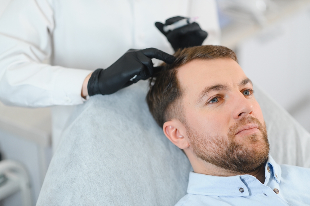 Patient receiving hair restoration surgery, an example of choosing a hair transplant clinic with proper standards