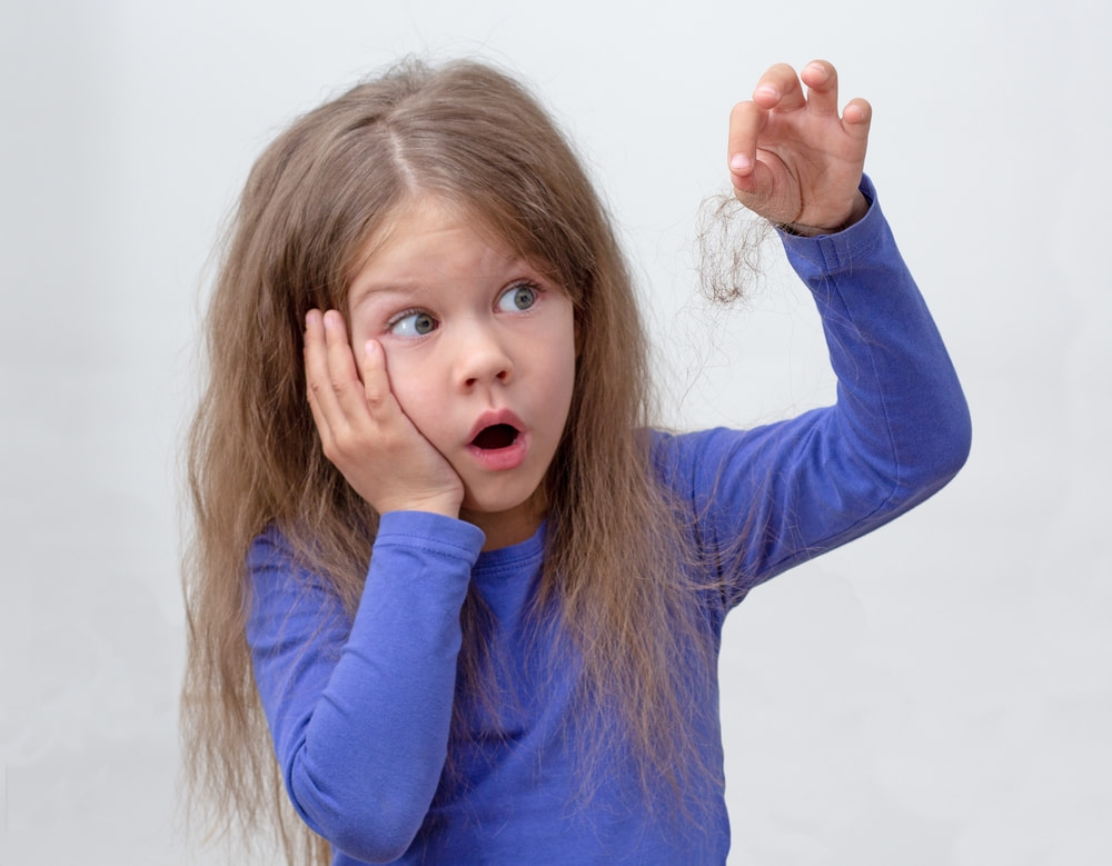 Little girl surprised to notice hair loss in children